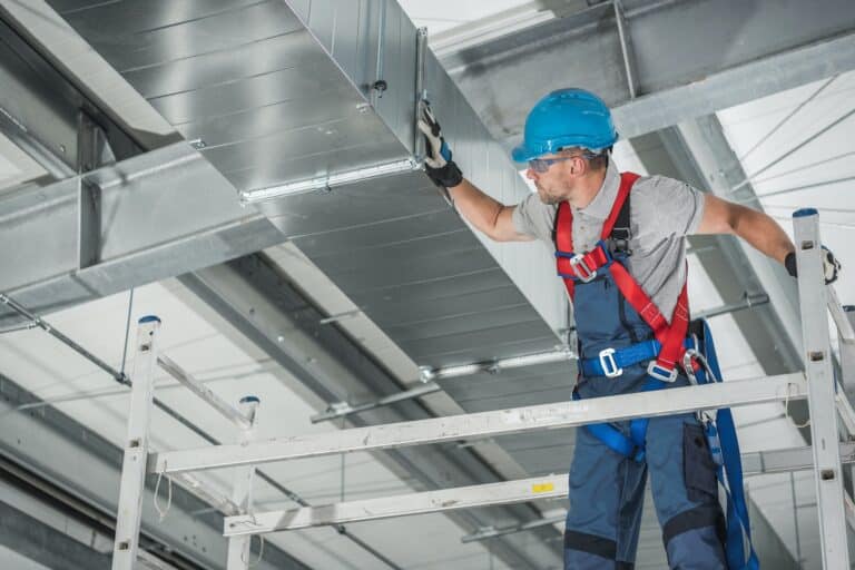 professional technician worker finishing newly assembled air vent shaft 2
